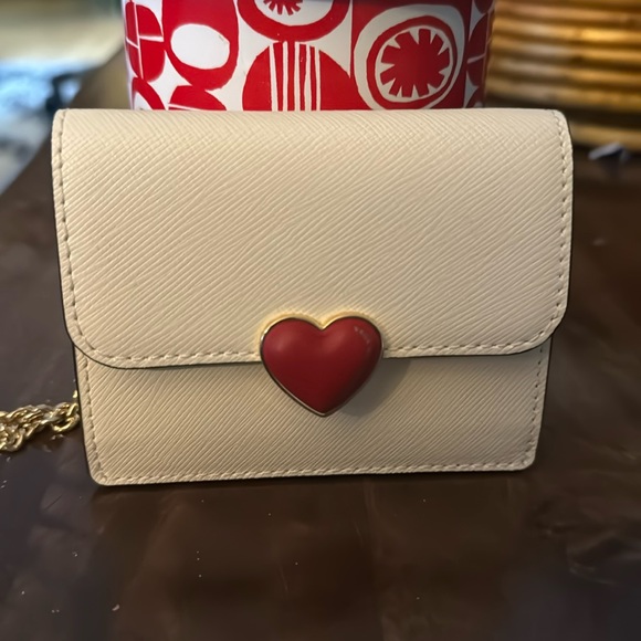 kate spade Handbags - New🎉with tag Kate Spade white with heart closure wallet